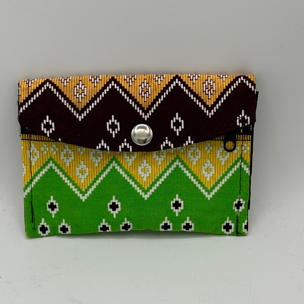 Fabric wallet with green, yellow, brown, and white geometric batik pattern